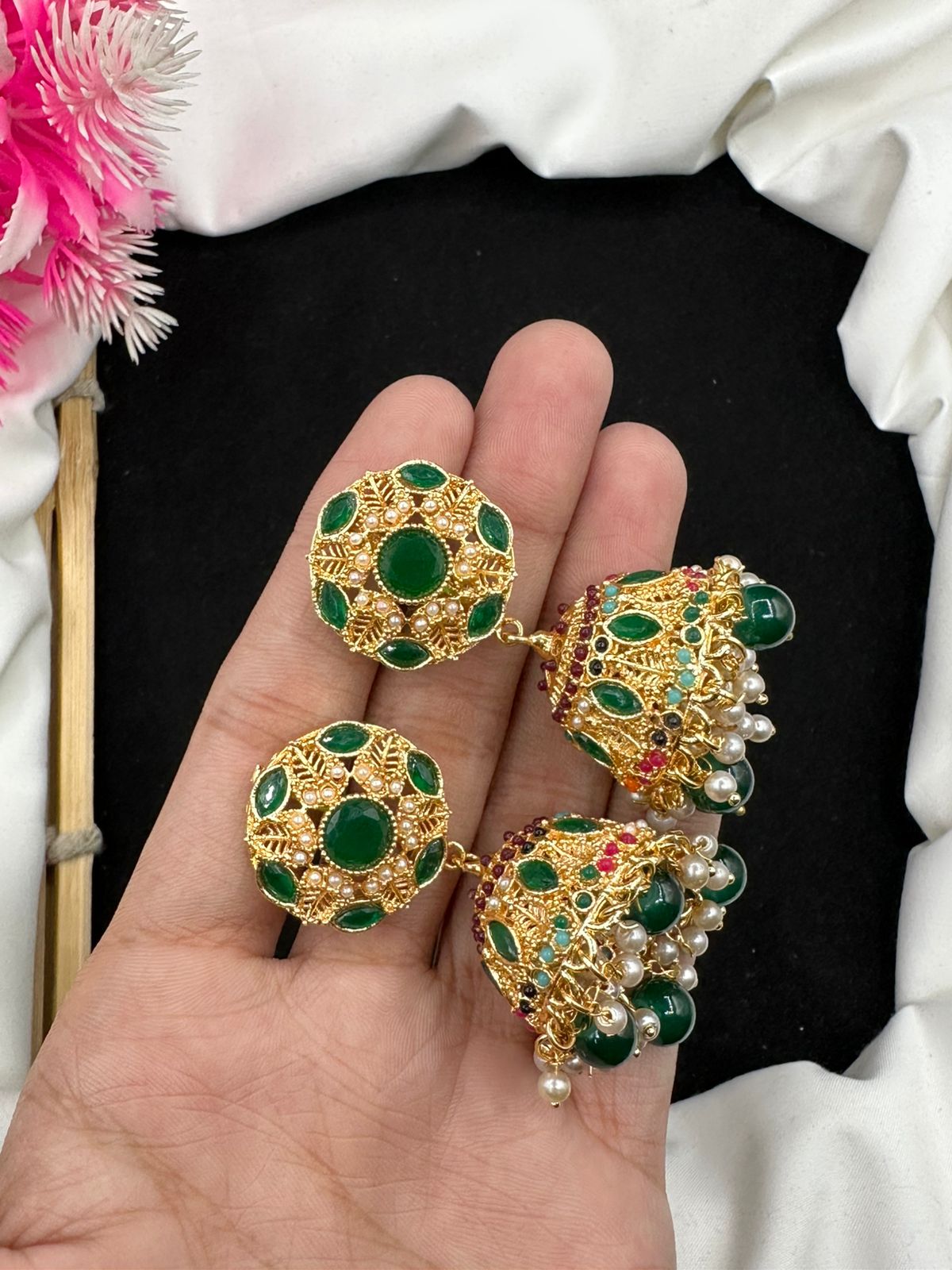 Elevate your style with our graceful Manjoos Jhumki, adorned with moti bandai & sparkling zircon work.