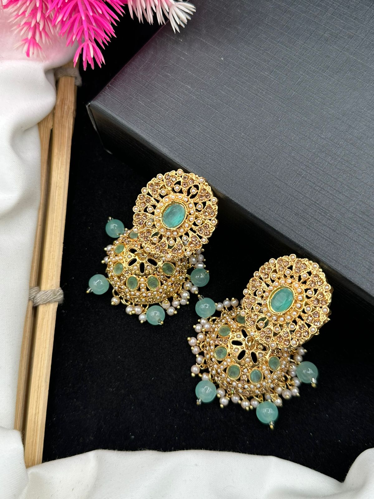 Elegant Zircon Jhumkis With Delicate Moti Bandhai Work.