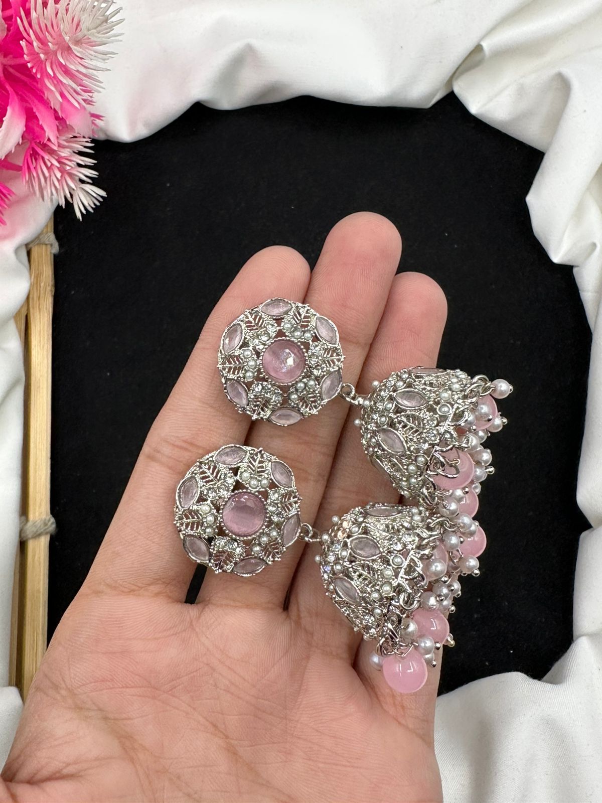 Elevate your style with our graceful Manjoos Jhumki, adorned with moti bandai & sparkling zircon work.