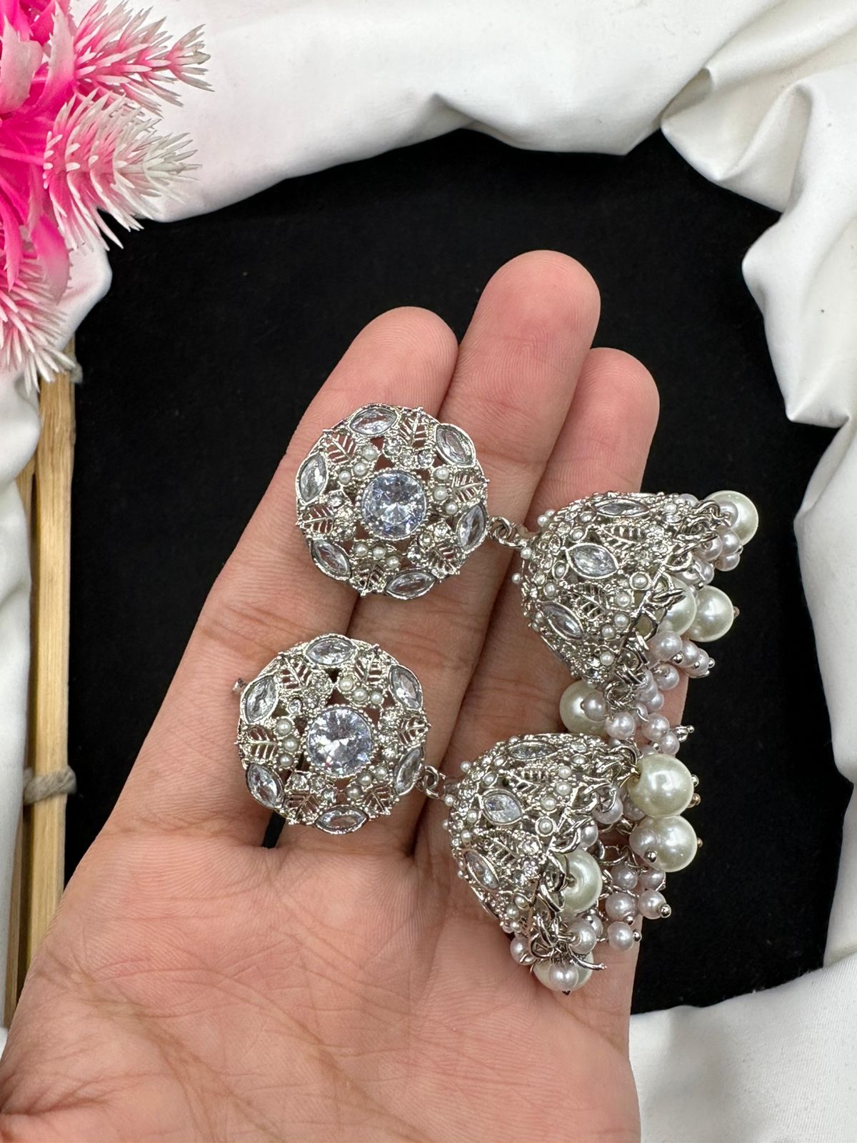 Elevate your style with our graceful Manjoos Jhumki, adorned with moti bandai & sparkling zircon work.