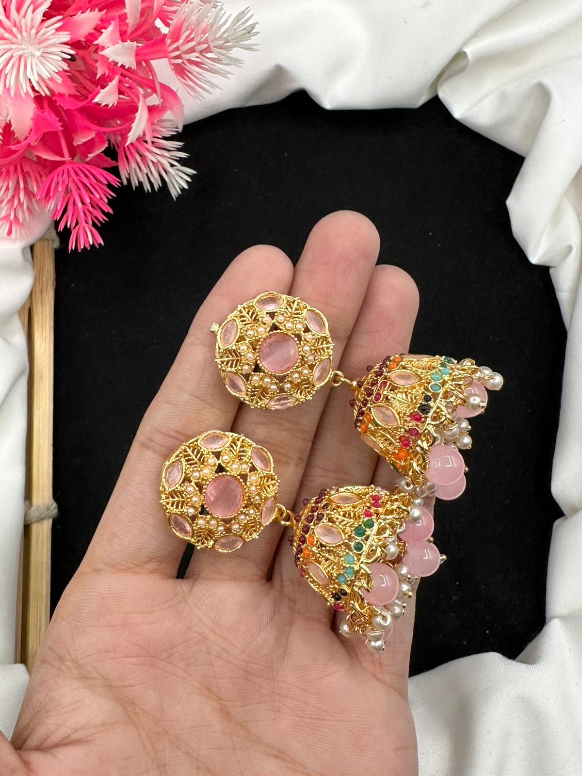 Elevate your style with our graceful Manjoos Jhumki, adorned with moti bandai & sparkling zircon work.