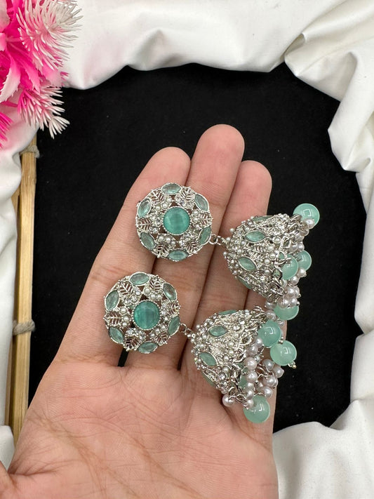Elevate your style with our graceful Manjoos Jhumki, adorned with moti bandai & sparkling zircon work.