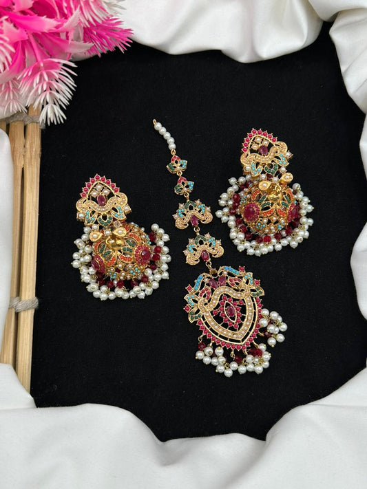 Elevate your style with nauaratan jhumki teeka.