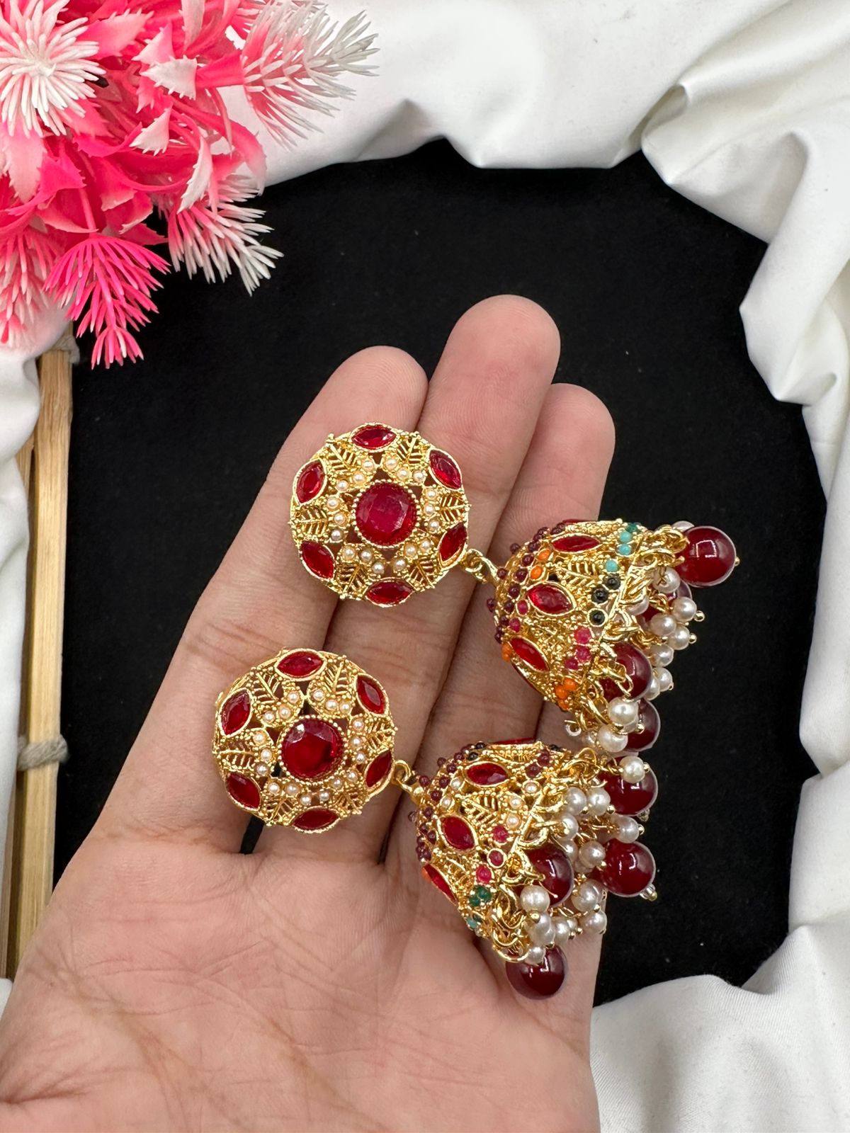 Elevate your style with our graceful Manjoos Jhumki, adorned with moti bandai & sparkling zircon work.
